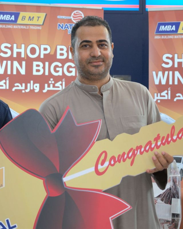 A winner of IMBA's 2025 draw holding the Congratulations key